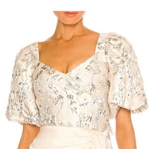 Simkhai size 2 cream metallic with side zip.